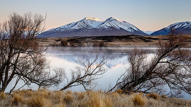a mountain reflected in a lake